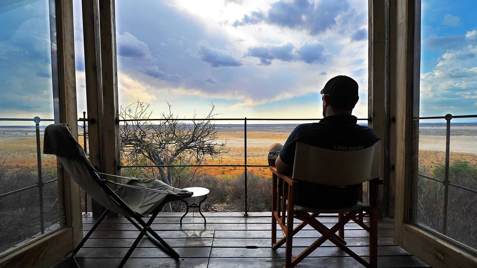 A person reclining on a patio 