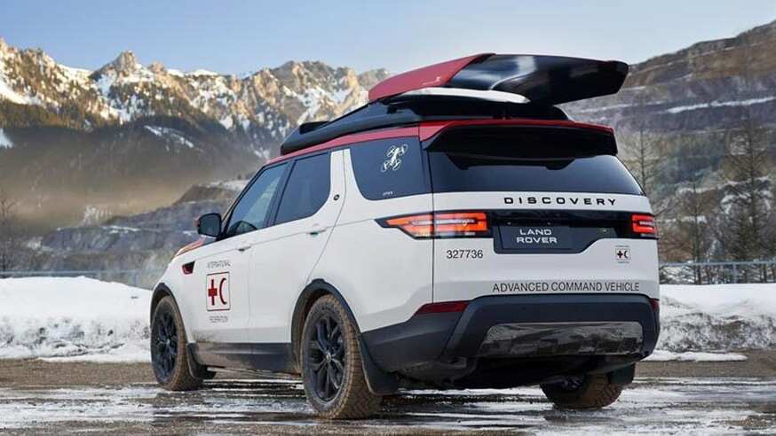 White Discovery in the snow with humanitarian and conservation branding on it