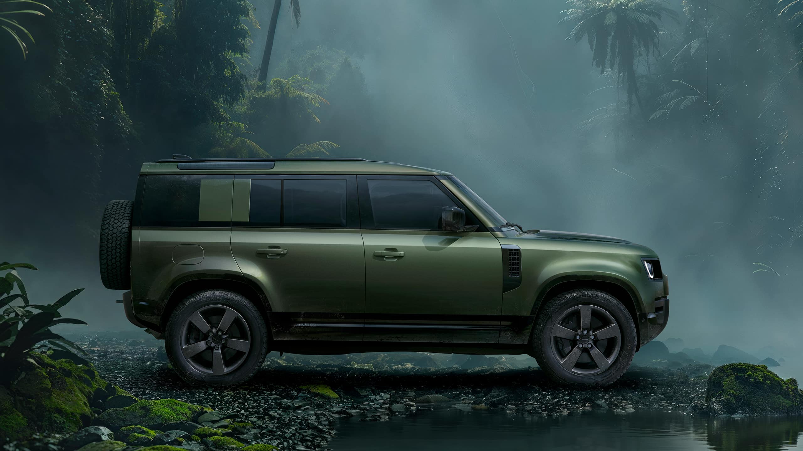 Defender parked in forest