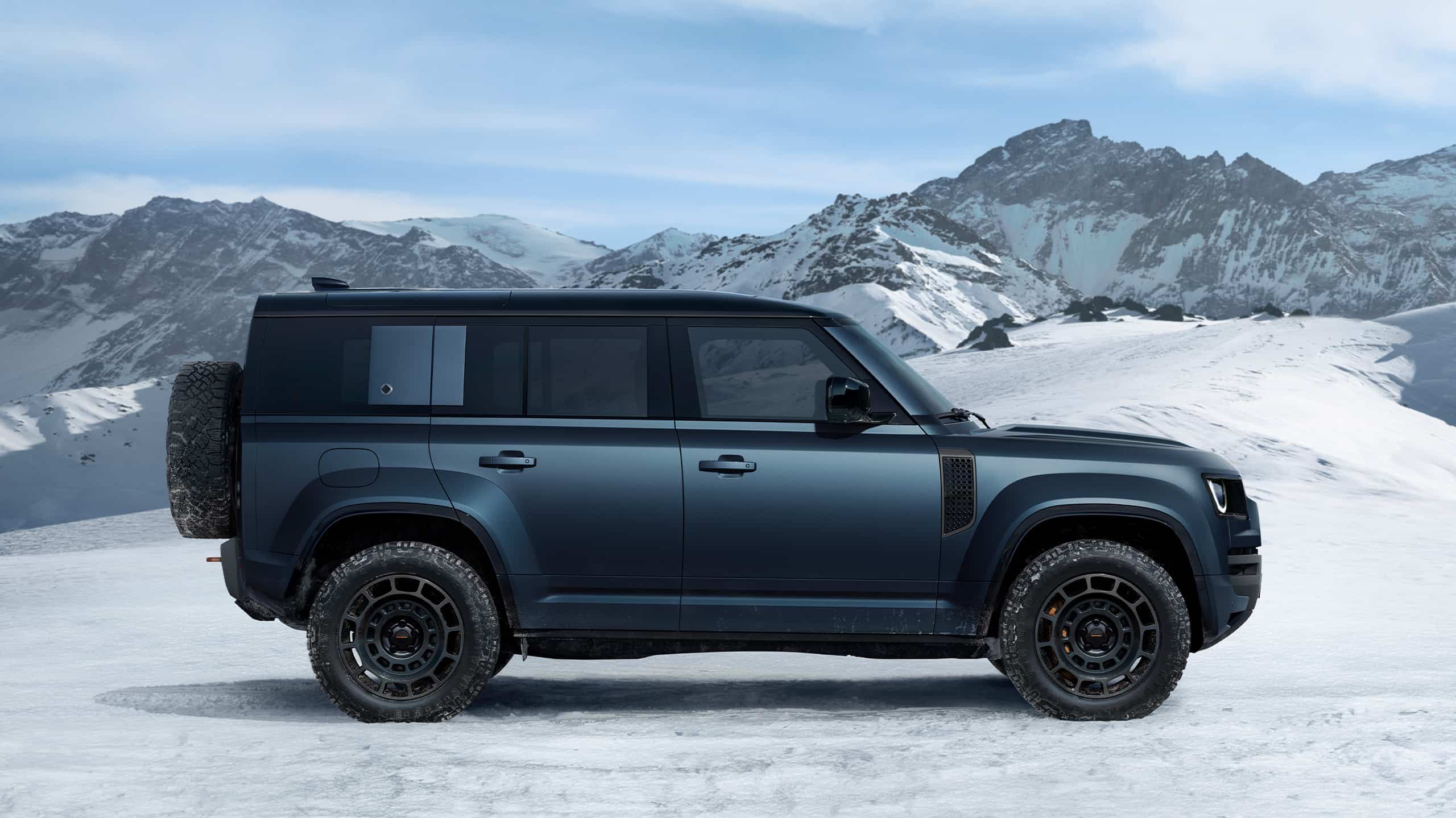 Defender driving on snowy off-road