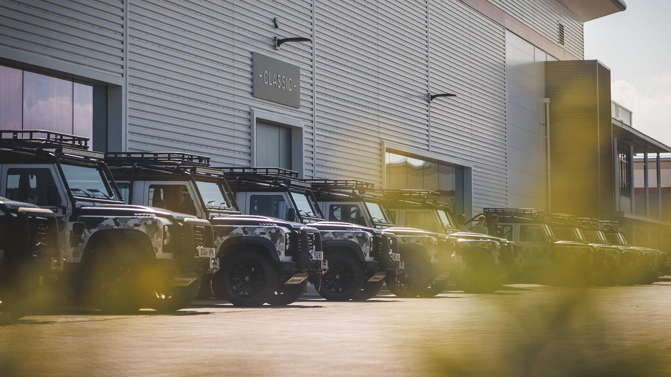 Defender Old model parked outside the workshop